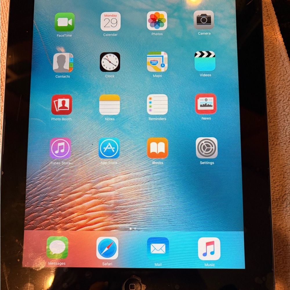 iPad 2 - Silver with Black Frame. Pre owned in good condition. Good for kids